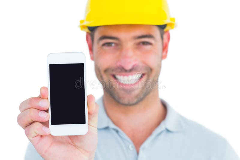 Portrait of smiling handyman showing smart phone on white background. Cut smiling stock images, royalty-free photos and pictures