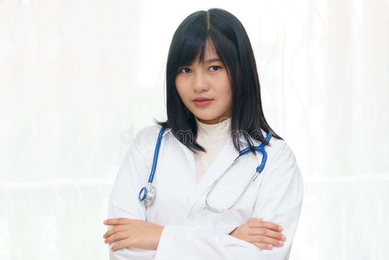 Portrait of smiling or happy asian female doctor on white background. royalty free stock images Portrait of smiling or happy asian female doctor on white background. royalty free stock images