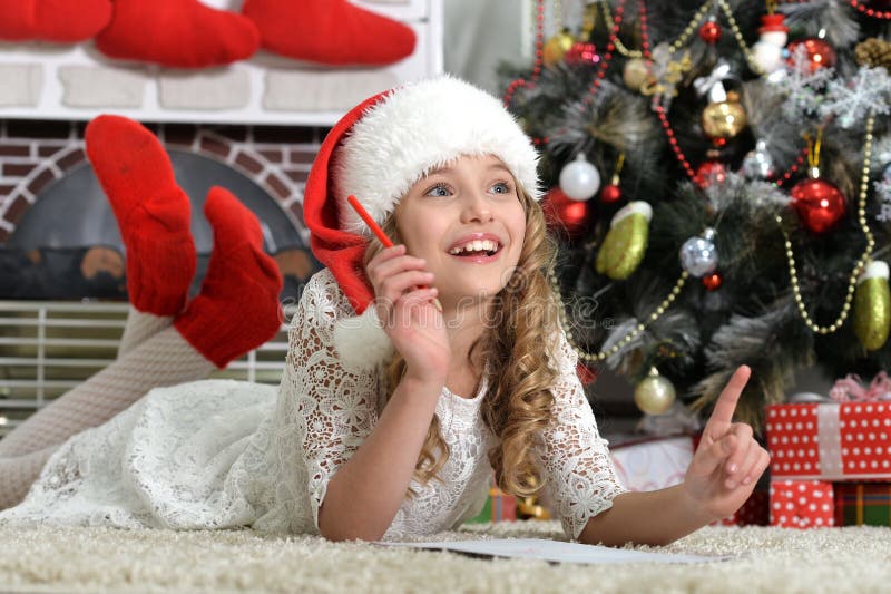 Portrait of cute little girl preparing to Christmas