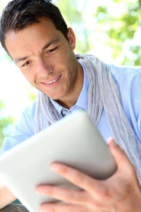 Portrait of smiling man using tablet stock image Portrait of smiling man using tablet stock image