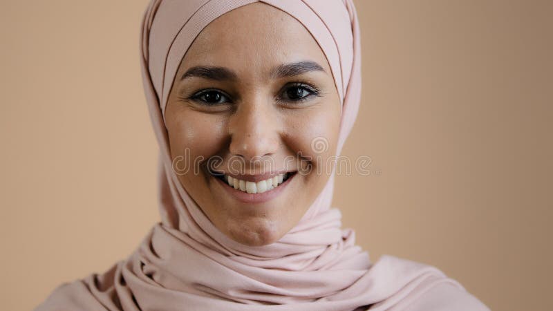 Portrait smiling muslim female headshot close-up face young girl in hijab looking at camera arab attractive woman in