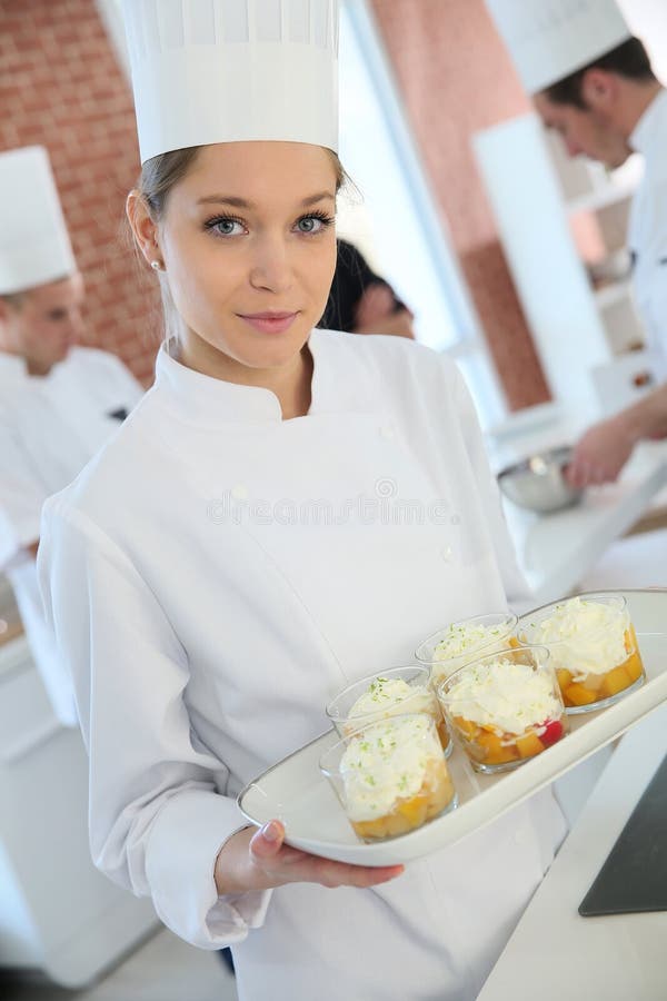 Young pastry cook at work stock photo. Image of cooking 32144912