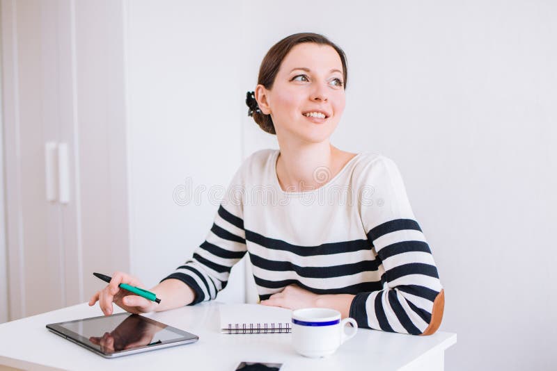 Portrait Of Smiling Pretty Young Business Woman Sitting On Workplace ...