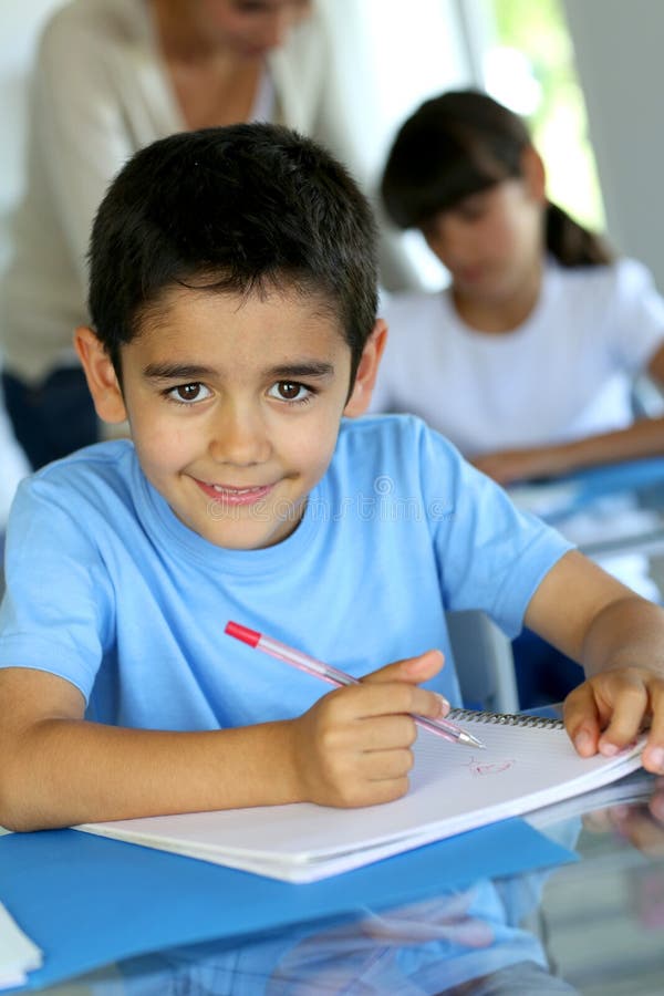 Portrait of smiling school pupil with pen and notebook royalty free stock image Portrait of smiling school pupil with pen and notebook royalty free stock image
