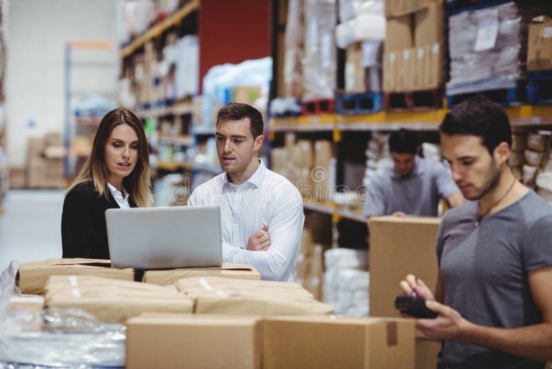 Portrait of smiling warehouse managers stock photos