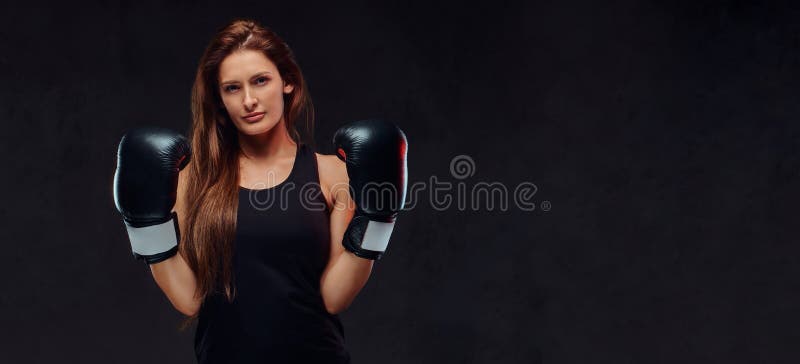 Sportive woman in sports bra wearing a protective helmet and