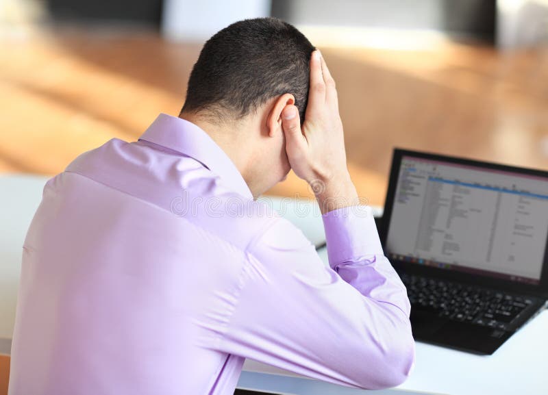 Portrait of stressful tired young businessman at work royalty free stock photography Portrait of stressful tired young businessman at work royalty free stock photography