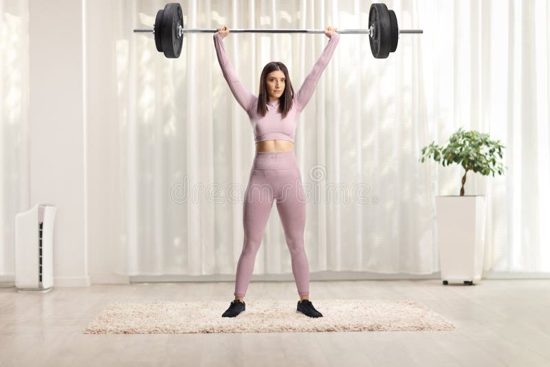 https://thumbs.dreamstime.com/b/portrait-strong-young-woman-exercising-weight-lifting-indoors-full-length-252940299.jpg