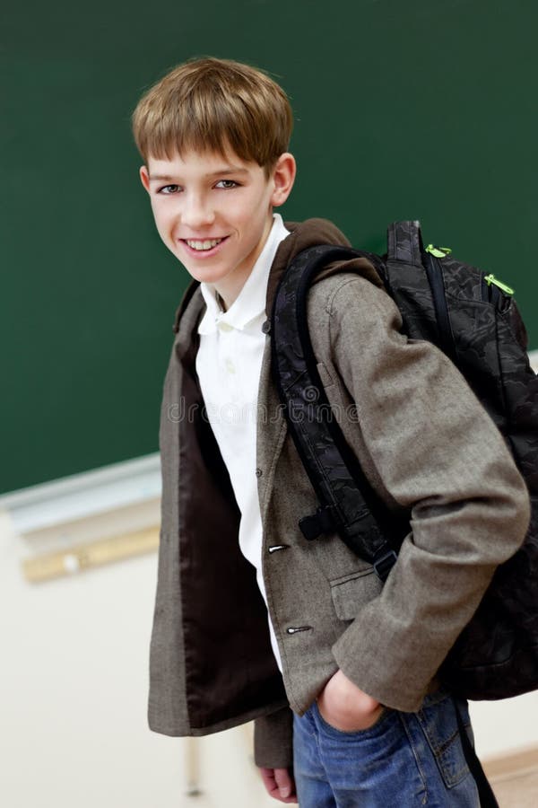 Portrait of student at blackboard background