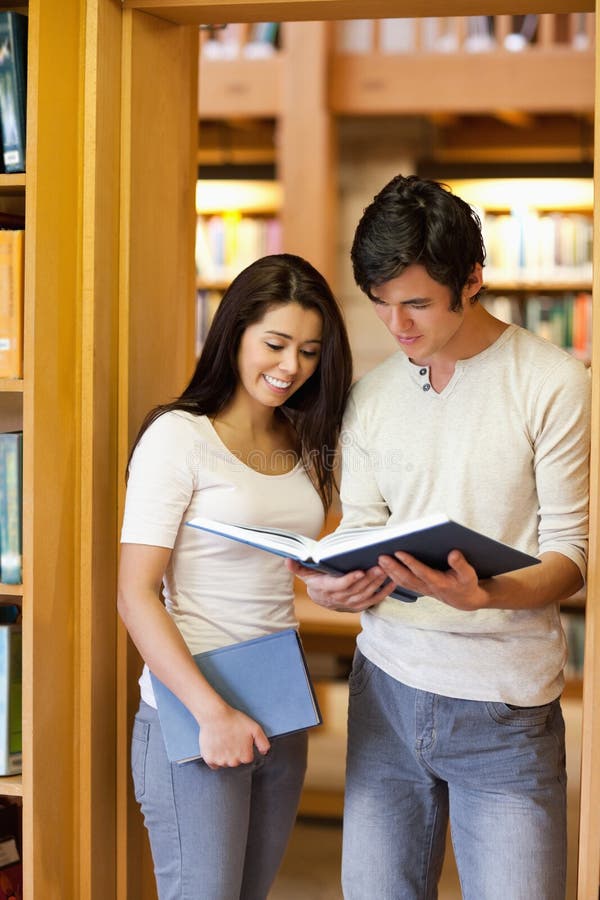 Download Portrait Of Students Looking At A Book Stock Image - Image of friends, memory: 21145559