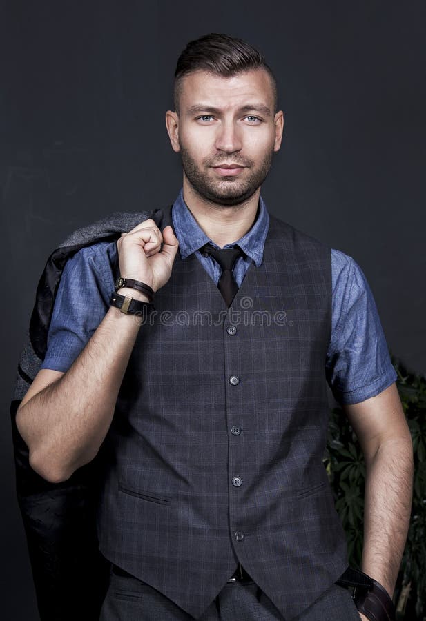 Portrait of Stylish Handsome Young Guy with Fashionable Hairdo Holds Jacket on His Shoulder. Business Man in a Waistcoat and Tie. Stock Image - Image of casual, hairstyle: 119319769 Portrait of Stylish Handsome Young Guy with Fashionable Hairdo Holds Jacket on His Shoulder. Business Man in a Waistcoat and Tie. Stock Image - Image of casual, hairstyle: 119319769