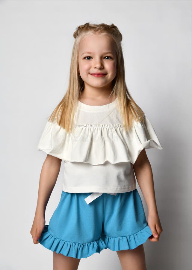 Portrait of a Stylish Little Girl in Summer Clothes on a White ...