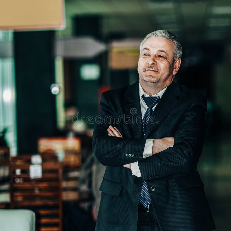 Portrait of a successful businessman on background of modern off royalty free stock image Portrait of a successful businessman on background of modern off royalty free stock image