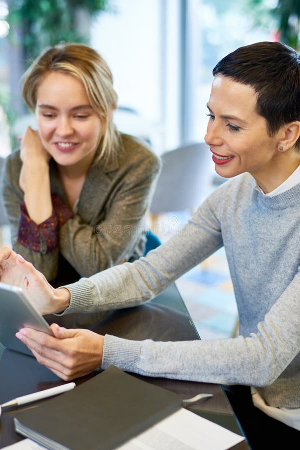 Cheerful Female Boss Meeting with Employee stock photography Cheerful Female Boss Meeting with Employee stock photography