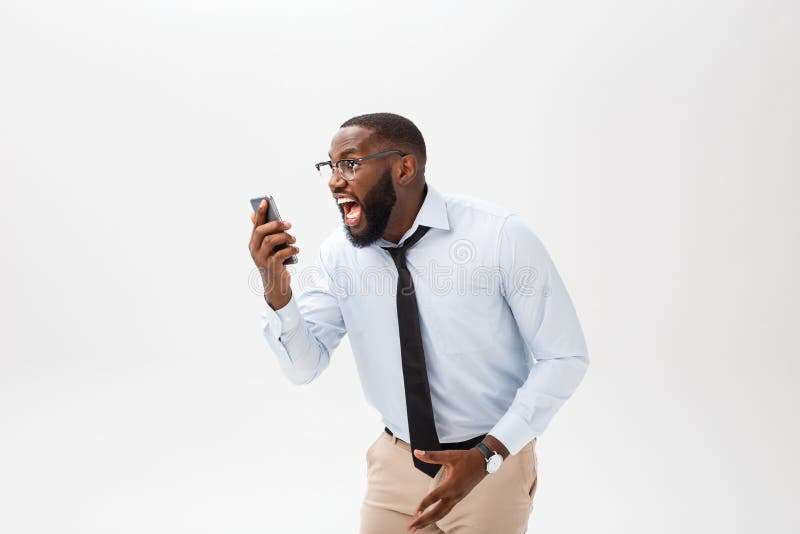 Portrait of a surprised African American businessman looking at his smart phone screen in disbelief. Concept of strong