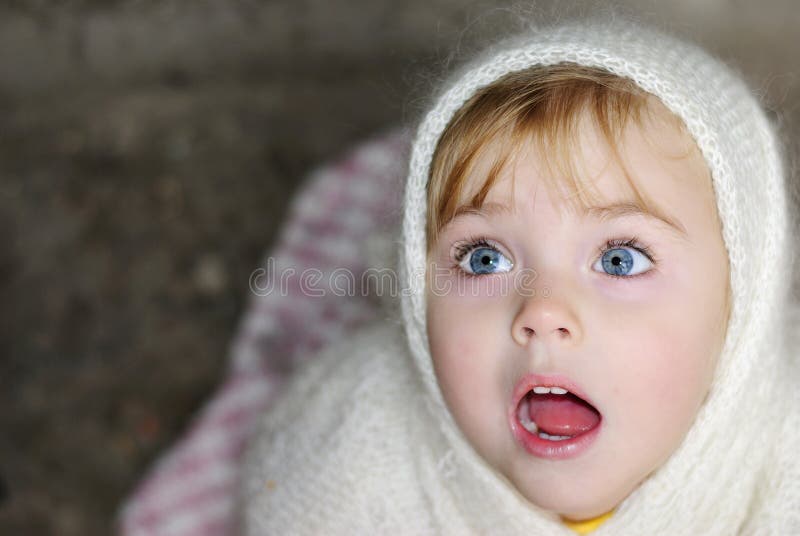 Portrait of the surprised little girl
