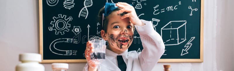 Portrait of surprised little scientist with dirty face holding glass with soap foam after a crazy experiment. Portrait of surprised little scientist with dirty face holding glass with soap foam after a crazy experiment