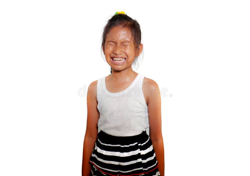 Portrait of sweet and cute female child 8 or 9 years old crying sad in pain feeling unhappy and upset isolated on white background