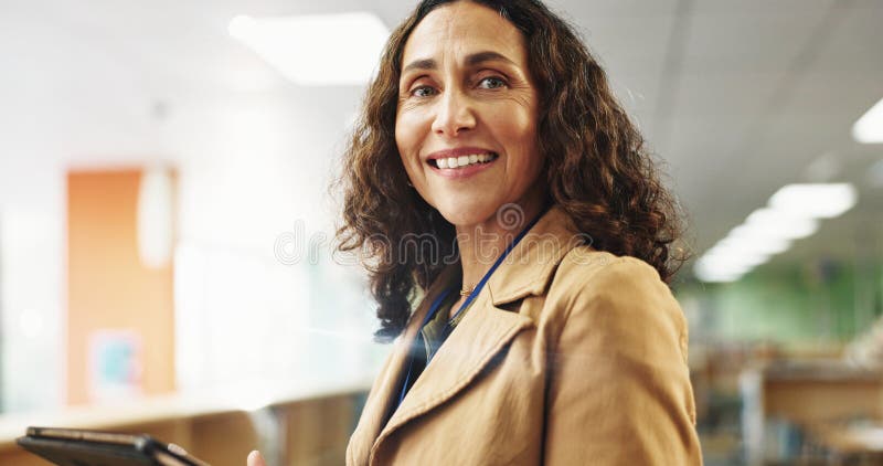 Portrait, teacher and woman with tablet, smile and confident for education in college and classroom. University royalty free stock photography