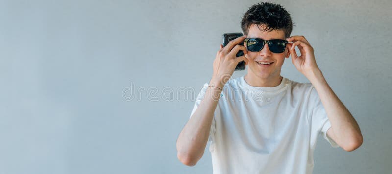 Teen boy with sunglasses stock image. Image of copyspace