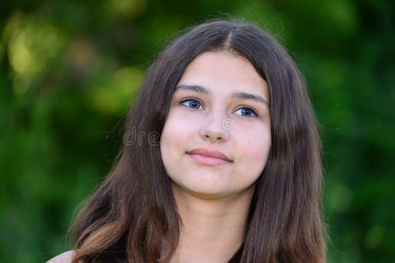 Portrait of teen brunette with long hair