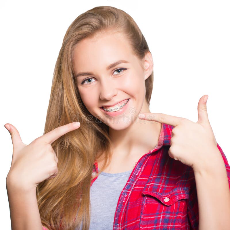 Portrait of teen girl showing dental braces.