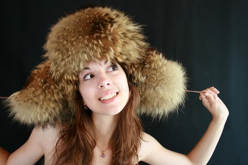 Portrait of the girl in a fur cap.