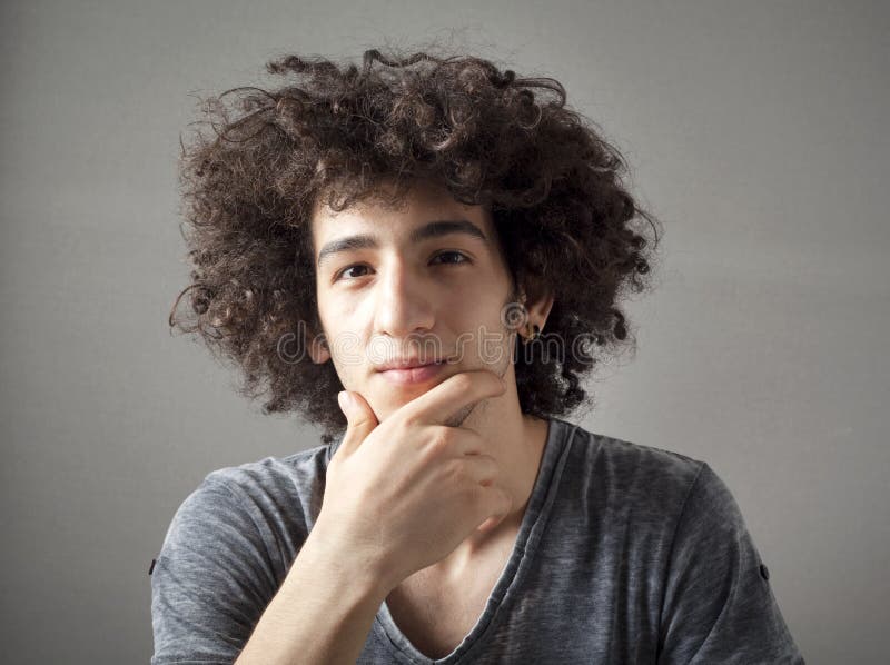 Portrait of thinking young man stock images
