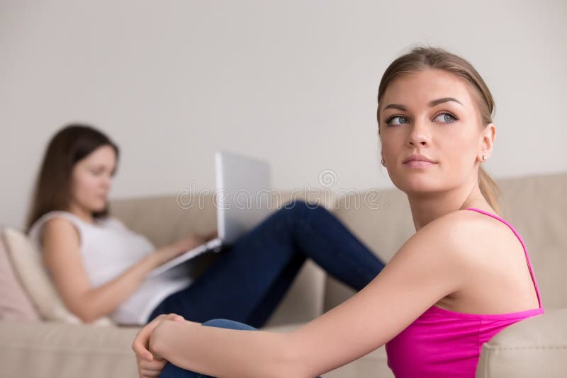Portrait of thoughtful girl, girlfriend with laptop on backgroun royalty free stock photography