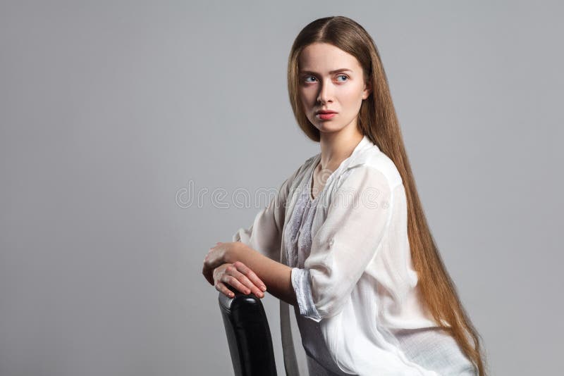 Portrait of thoughtful serious young model actor with long brown stock photo Portrait of thoughtful serious young model actor with long brown stock photo