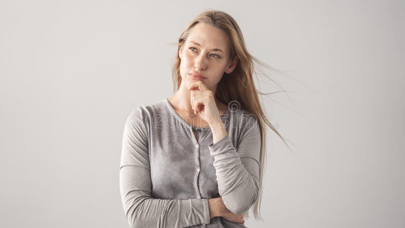 Portrait of thoughtful woman looking away royalty free stock image