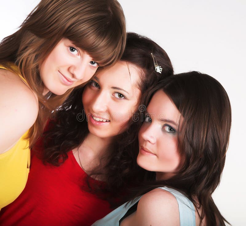 Portrait of three smiling girlfriends