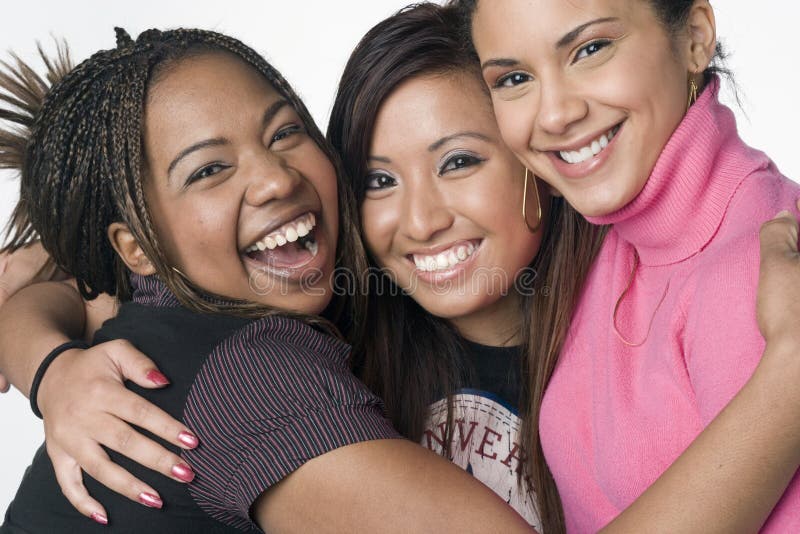 Portrait of three teenage mixed race girls