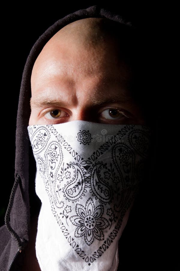 Portrait of a thug in mask at night royalty free stock photo