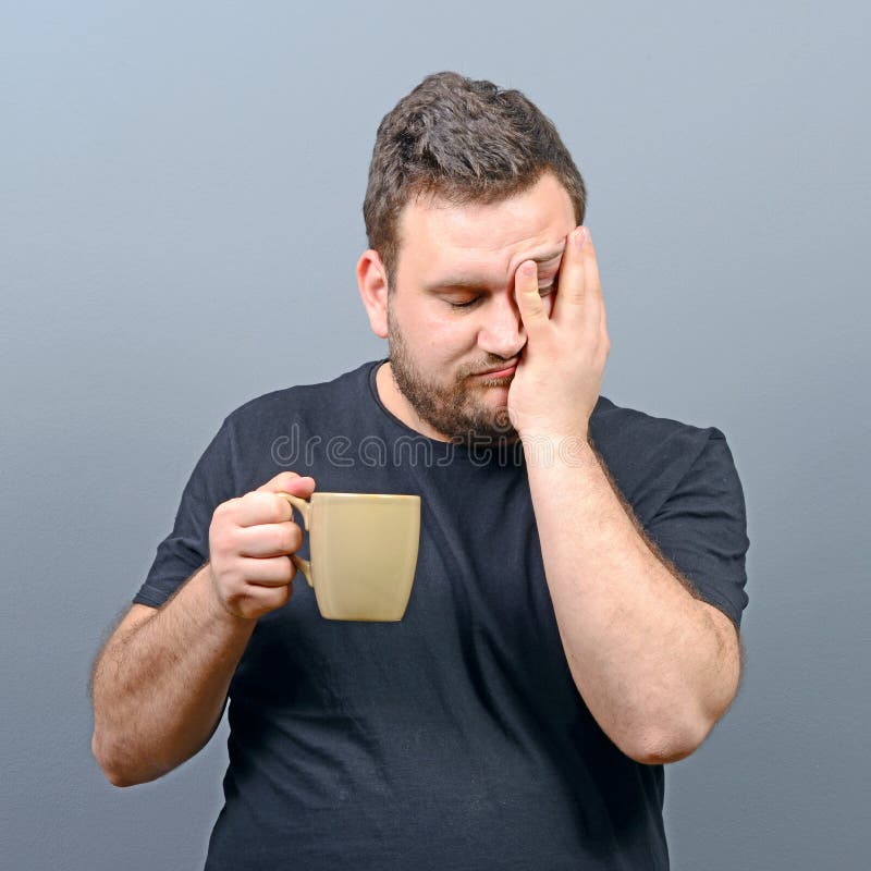 Portrait of Tired Man Having First Morning Coffee and Still Sleepy