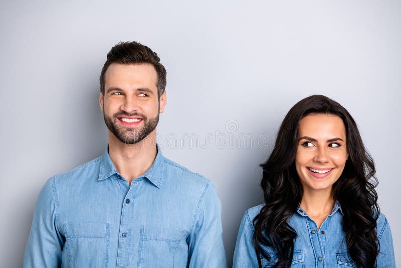 Portrait of two affectionate pretty modest students workers meeting feeling carefree positive isolated dressed in blue stock images