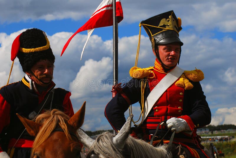 Portrait of two brave reenactors dressed as Napoleonic war soldiers. royalty free stock image