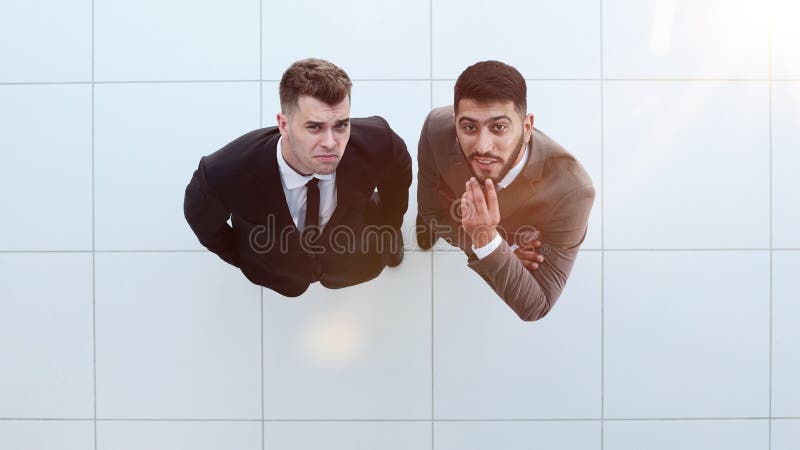 Portrait of two concentrated businessmen partners dressed in formal suit royalty free stock images