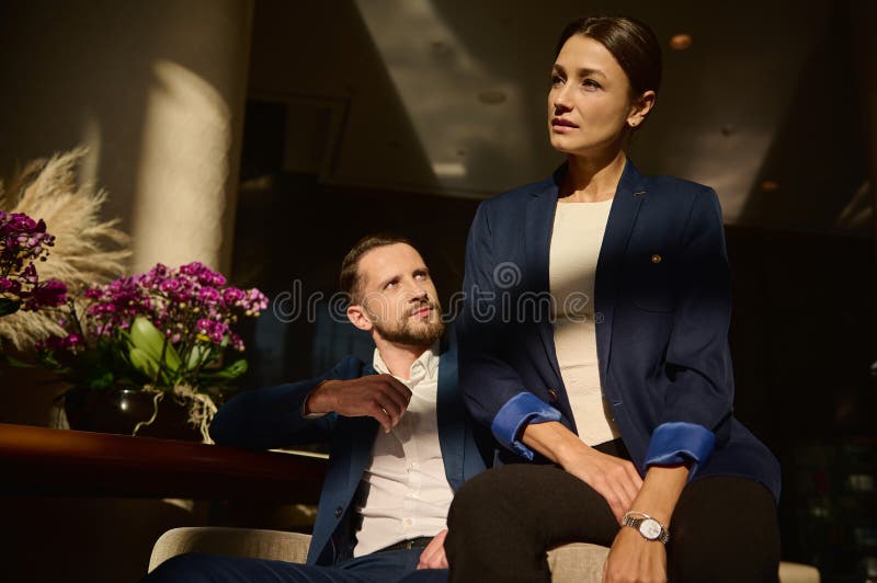 Portrait Of Two Confident People Colleagues On Business Trip Caucasian Woman And Man