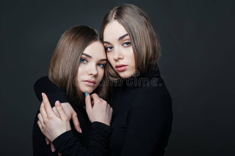 Portrait of Two Girls in Arms on Dark Background, Older Sister, Family or  Friendship Stock Photo - Image of twins, beautiful: 173104272