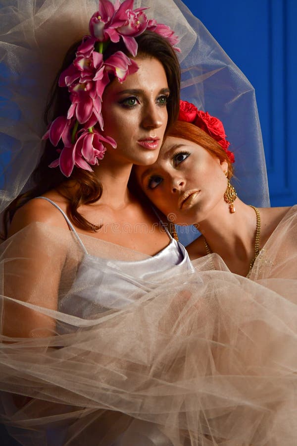 Portrait Of The Two Gorgeous Ladies With Wild Flowers Elegance 