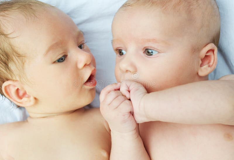 Two babies talking stock photo. Image of childhood, care 7433336
