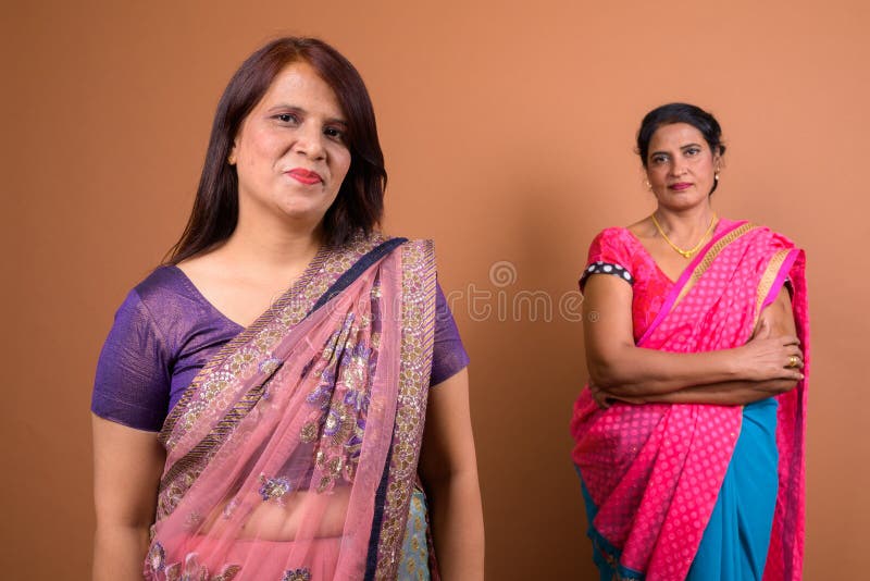 Portrait Of Two Mature Indian Woman Wearing Traditional Clothes Stock