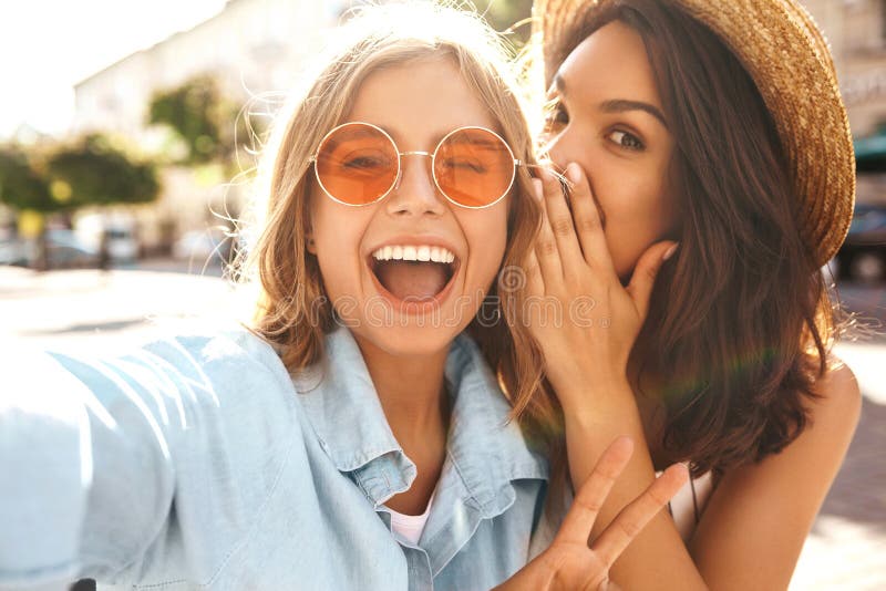 Two young stylish hippie brunette and blond women models royalty free stock image Two young stylish hippie brunette and blond women models royalty free stock image