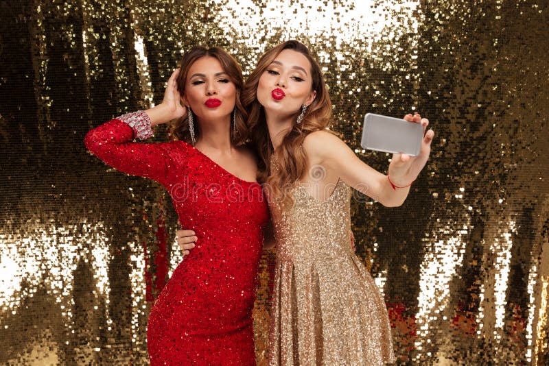 Portrait of Two Pretty Young Women in Sparkly Dresses Stock Photo ...