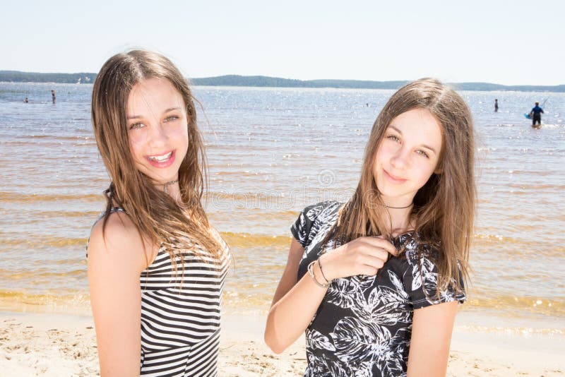 Two sisters twins in the summer beach vacation beauty teenager girls stock images Two sisters twins in the summer beach vacation beauty teenager girls stock images
