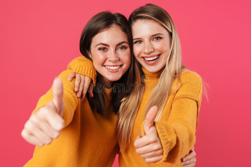 Portrait of two young female friends standing