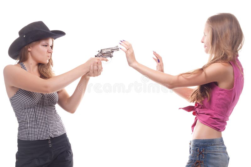 Portrait of two young girls with a gun