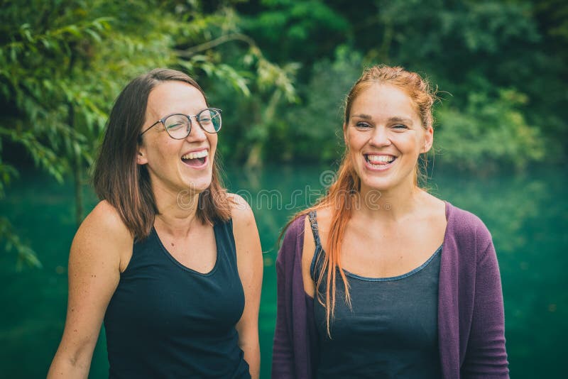 Two young women having fun outdoors stock photos Two young women having fun outdoors stock photos