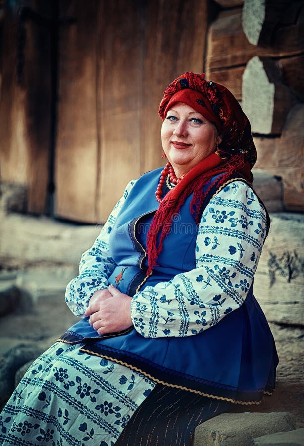 Portrait Of Ukraininan Woman In Traditional Costume Sitting On The